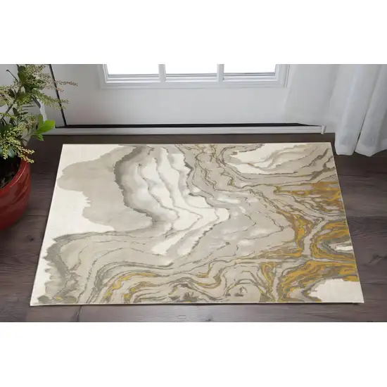 Gold Ivory And Gray Abstract Stain Resistant Area Rug Photo 1