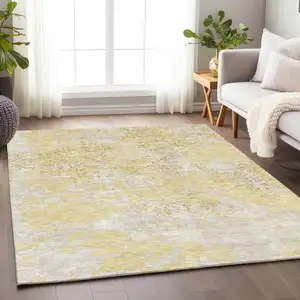 Photo of Gold Ivory And Gray Abstract Washable Area Rug With UV Protection
