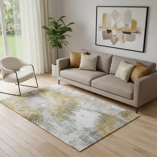 Gold Ivory And Gray Abstract Washable Area Rug With UV Protection Photo 1