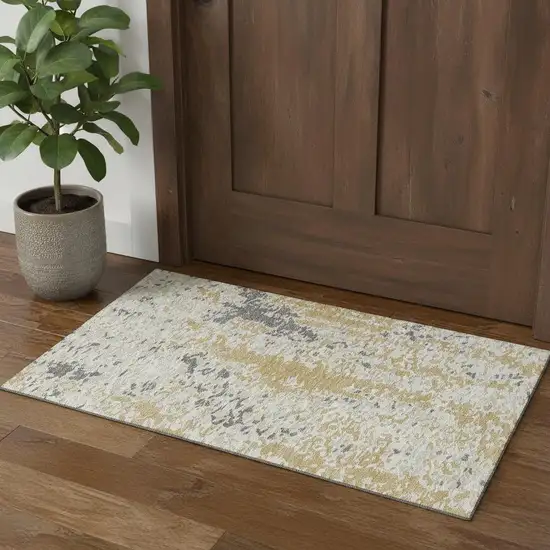 Gold Ivory And Gray Abstract Washable Area Rug With UV Protection Photo 1