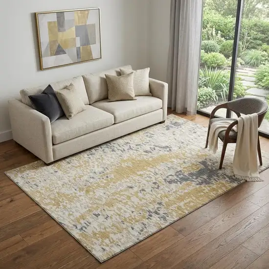 Gold Ivory And Gray Abstract Washable Area Rug With UV Protection Photo 1