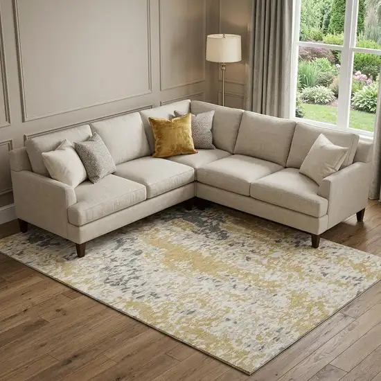 Gold Ivory And Gray Abstract Washable Area Rug With UV Protection Photo 1
