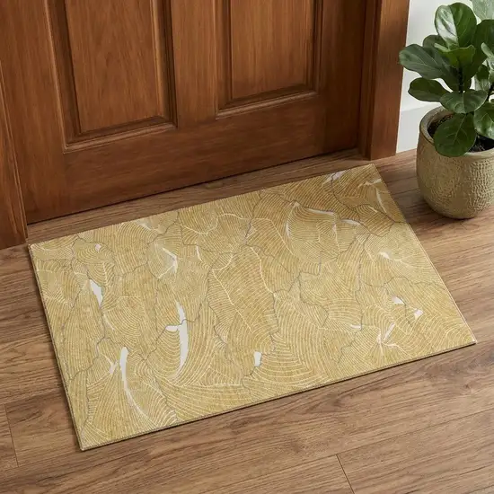 Gold Ivory And Gray Abstract Washable Area Rug With UV Protection Photo 1