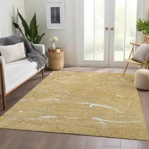 Photo of Gold Ivory And Gray Abstract Washable Area Rug With UV Protection
