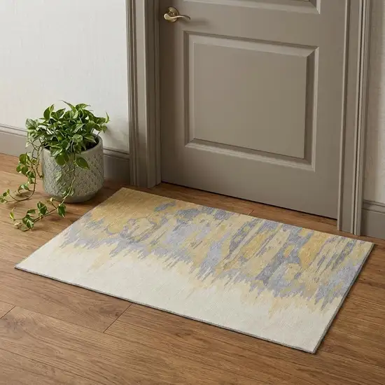 Gold Ivory And Gray Abstract Washable Area Rug With UV Protection Photo 1