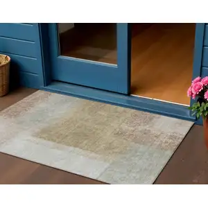 Photo of Gold Ivory And Gray Abstract Washable Indoor Outdoor Area Rug