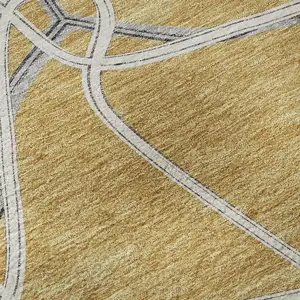 Photo of Gold Ivory And Gray Geometric Washable Area Rug With UV Protection