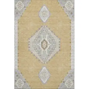 Photo of Gold Ivory And Gray Oriental Washable Area Rug With UV Protection