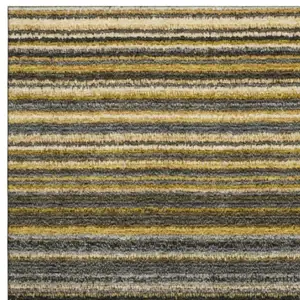 Photo of Gold Ivory And Gray Striped Washable Area Rug With UV Protection