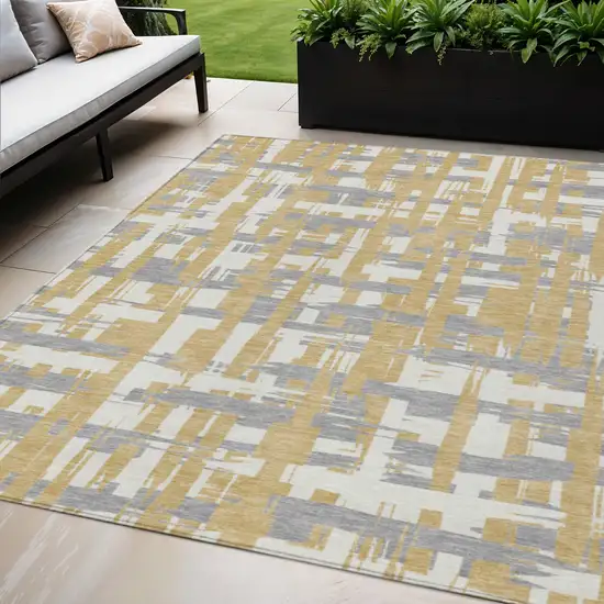 Gold Ivory And Gray Striped Washable Indoor Outdoor Area Rug Photo 2