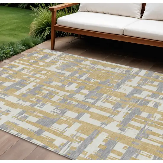 Gold Ivory And Gray Striped Washable Indoor Outdoor Area Rug Photo 2