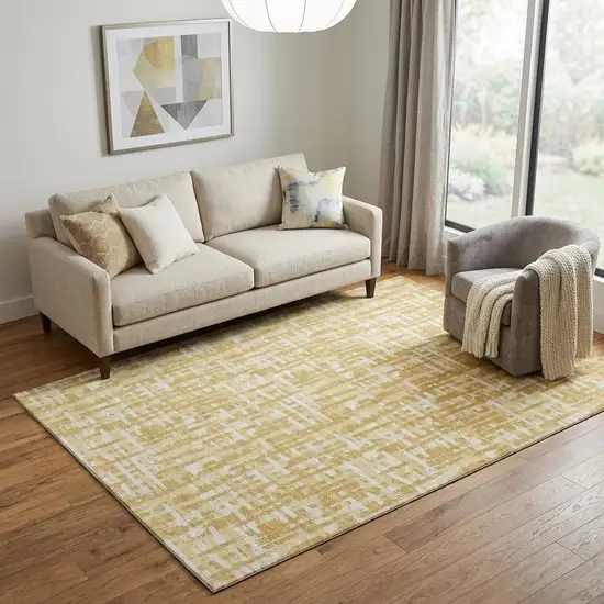 Gold Ivory And Wheat Abstract Geometric Washable Area Rug With UV Protection Photo 1