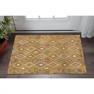 Photo of Gold Orange Brown Red Green Purple And Beige Southwestern Printed Stain Resistant Non Skid Area Rug