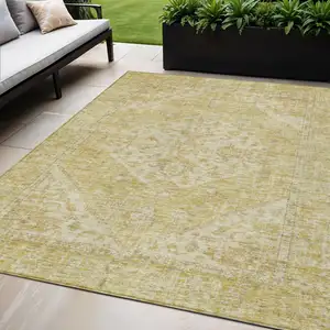 Photo of Gold Tan And Beige Oriental Washable Indoor Outdoor Area Rug