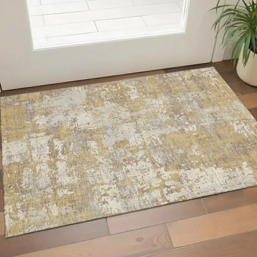 Gold Taupe And Beige Abstract Washable Area Rug With UV Protection Photo 1