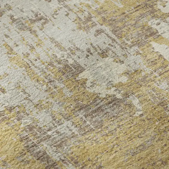 Gold Taupe And Beige Abstract Washable Area Rug With UV Protection Photo 1