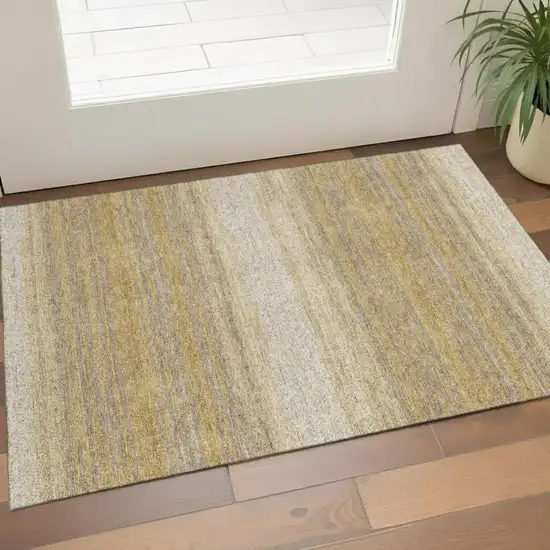Gold Taupe And Ivory Striped Washable Area Rug With UV Protection Photo 1