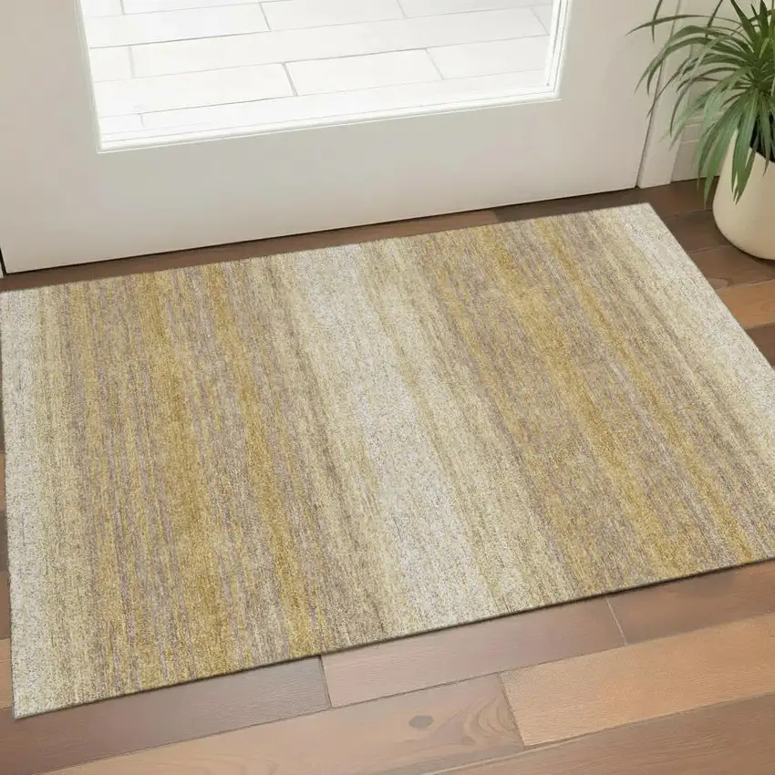 Gold Taupe And Ivory Striped Washable Area Rug With UV Protection Photo 1