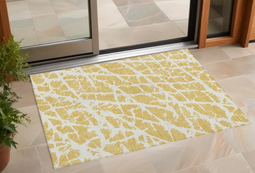 Gold and White Abstract Washable Non Skid Indoor Outdoor Area Rug Photo 1
