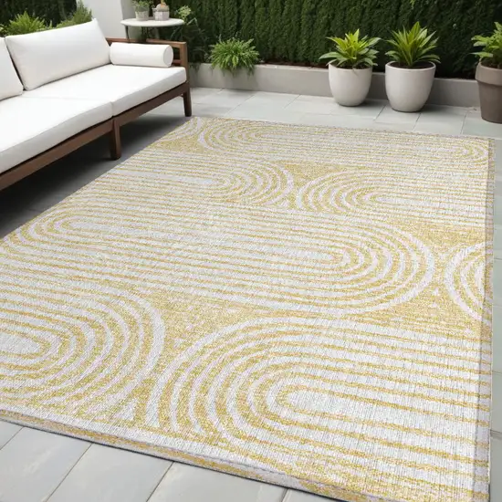 Gold and White Abstract Washable Non Skid Indoor Outdoor Area Rug Photo 1