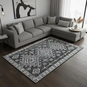 Photo of Graphite And Charcoal Geometric Washable Area Rug With UV Protection