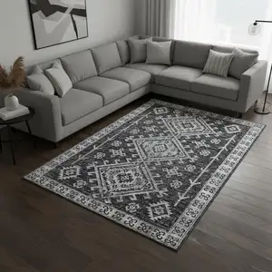 Photo of Graphite And Charcoal Geometric Washable Area Rug With UV Protection