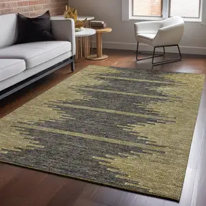 Photo of Graphite And Gold Abstract Washable Area Rug With UV Protection