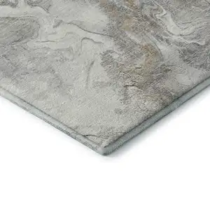 Photo of Graphite Beige And Ivory Abstract Washable Area Rug With UV Protection