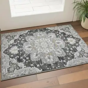 Photo of Graphite Gold And Charcoal Floral Medallion Washable Area Rug With UV Protection