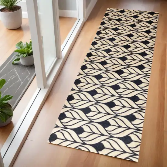 2' X 6' Graphite and Tan Abstract Leaves Washable Runner Rug Photo 1