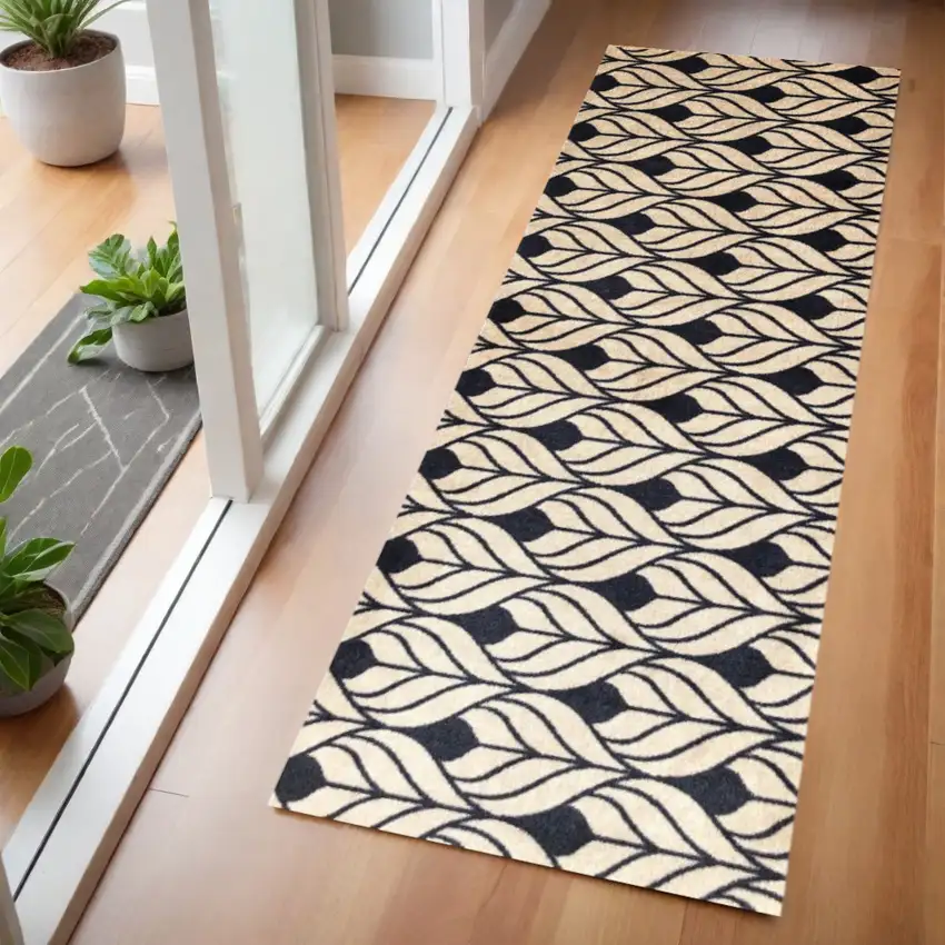 2' X 6' Graphite and Tan Abstract Leaves Washable Runner Rug Photo 1