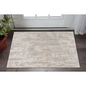 Photo of Gray And Beige Abstract Area Rug