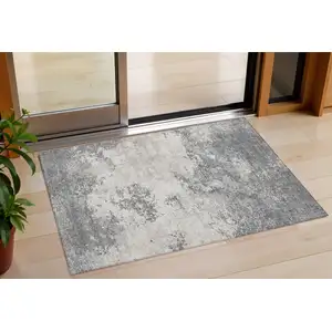 Photo of Gray And Beige Abstract Washable Indoor Outdoor Area Rug