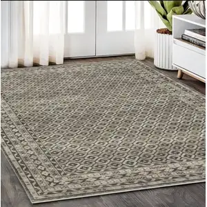 Photo of Gray And Beige Diamond Area Rug With Fringe