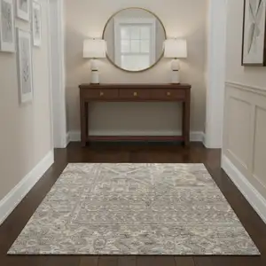 Photo of Gray And Beige Floral Area Rug With Fringe