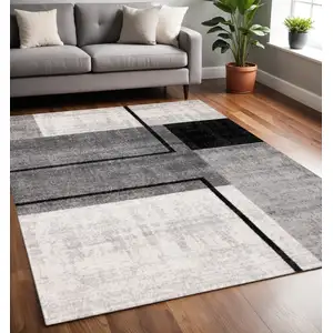 Photo of Gray And Black Abstract Area Rug