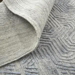 Photo of Gray And Blue Abstract Hand Woven Distressed Area Rug
