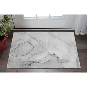 Photo of Gray And Charcoal Abstract Washable Area Rug With UV Protection