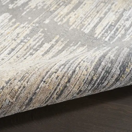 Gray And Gold Abstract Area Rug With Fringe Photo 9