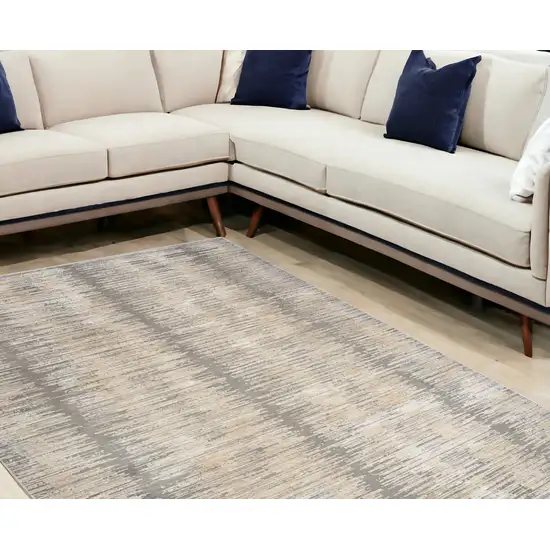 Gray And Gold Abstract Area Rug With Fringe Photo 1