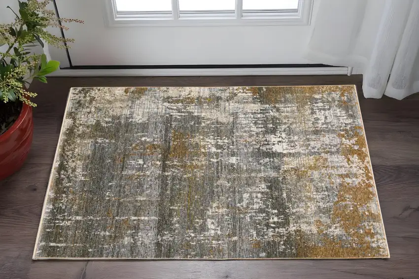 Gray And Gold Abstract Area Rug With Fringe Photo 1