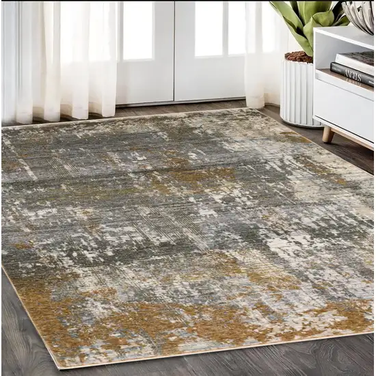 Gray And Gold Abstract Area Rug With Fringe Photo 1