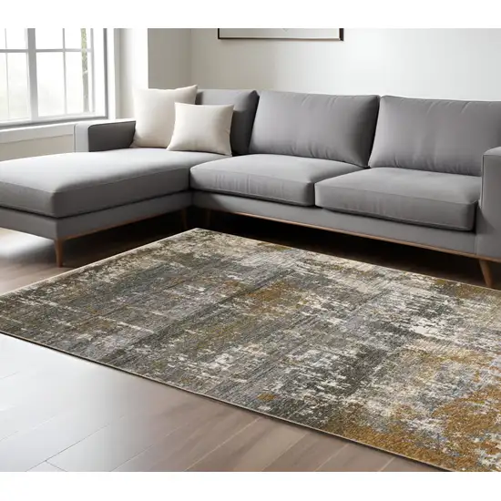 Gray And Gold Abstract Area Rug With Fringe Photo 1
