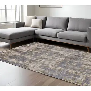 Photo of Gray And Gold Abstract Stain Resistant Area Rug