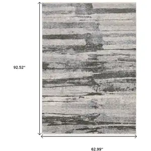 Photo of Gray And Ivory Abstract Area Rug With Fringe