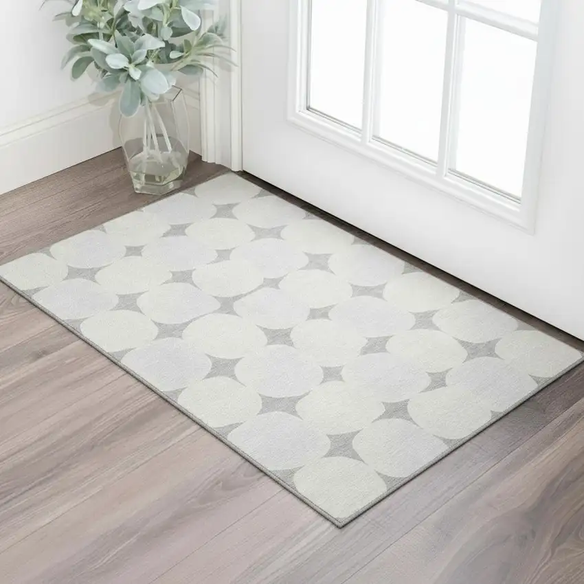 Gray And Ivory Abstract Geometric Washable Area Rug With UV Protection Photo 1