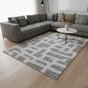 Photo of Gray And Ivory Abstract Geometric Washable Area Rug With UV Protection