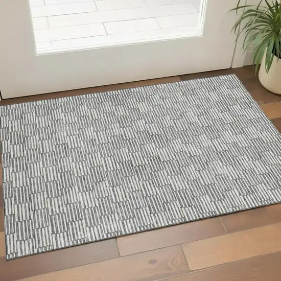 Gray And Ivory Abstract Geometric Washable Area Rug With UV Protection Photo 1
