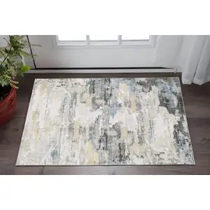 Photo of Gray And Ivory Abstract Printed Stain Resistant Non Skid Area Rug