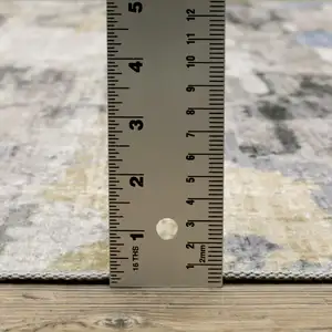 Photo of Gray And Ivory Abstract Printed Stain Resistant Non Skid Area Rug